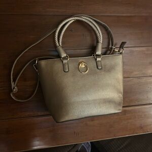 Gold Shoulder Bag with Detachable Strap and Metallic Emblem